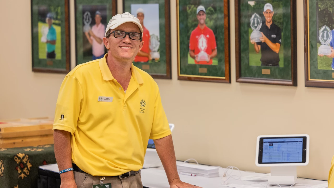 Volunteer in yellow Memorial Tournament Polo